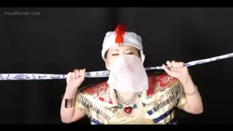 Asian Veiled Beauty in Costume