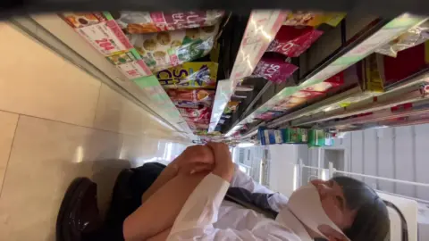 Asian Girl Shopping in Store