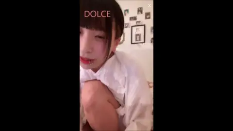 Asian Teen Undresses on Bed