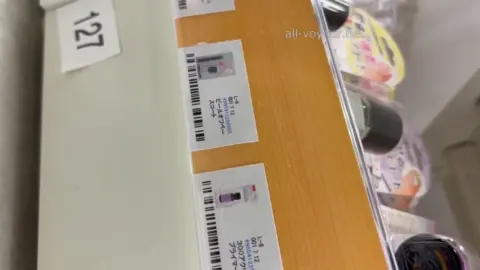 Asian Girl Trying On Clothes in Store