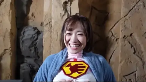 Asian Performer in Superhero and Camouflage Outfits