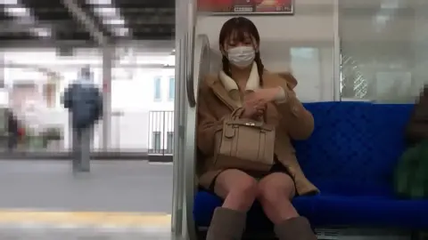Asian Woman in Tan Coat and Boots