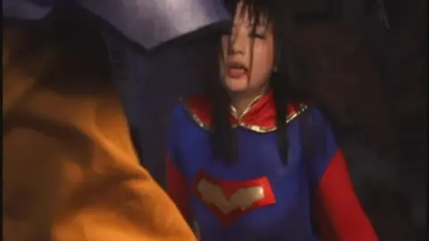 Asian Couple in Superman Costumes – Intimate Encounter