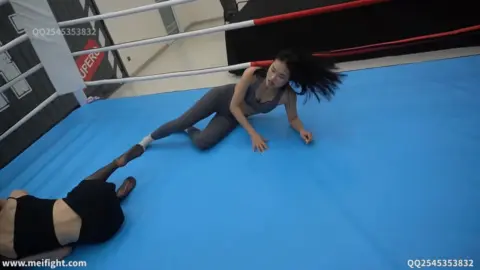 Asian Women Engaging in Wrestling Match