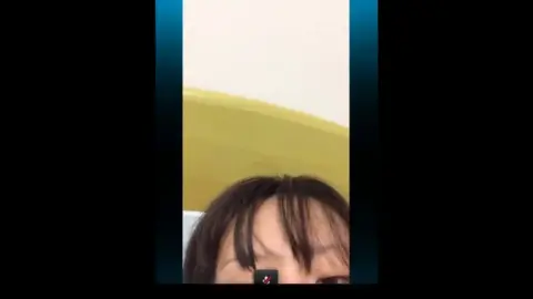 Dark-Haired Beauty Undresses and Poses