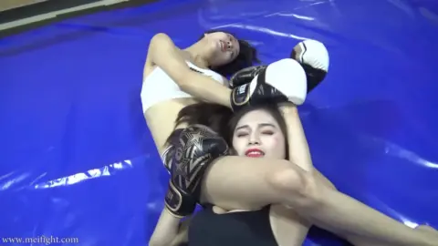 Asian Women Engage in Boxing Match