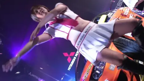 Asian Dancers on Stage with Motorcycle Prop