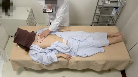 Asian Couple Medical Exam and Massage