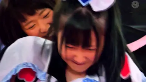 Asian Maids Engage in Wrestling Match