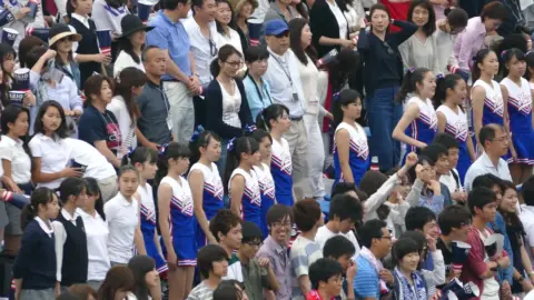 Asian Cheerleaders in Blue Uniforms