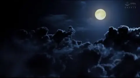 Asian Women in Red Costumes Engage in Erotic Play