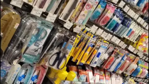 Asian Woman Shopping in Store