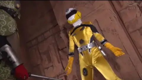 Asian Superheroines in Costumes Engage in Erotic Scenes