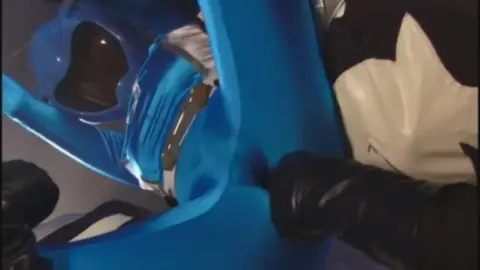 Muscular Men in Costumes Engage in Mock Fight