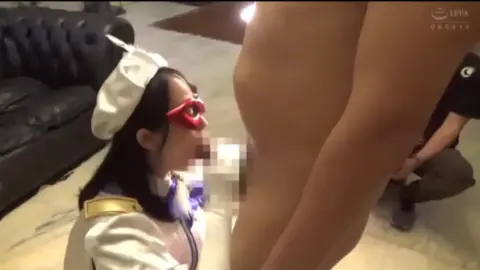 Asian Girl in Red Mask Performs Oral Sex on Two Men