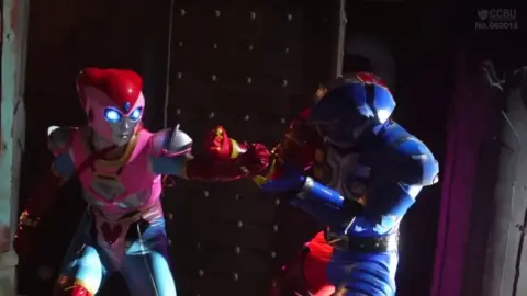 Costumed Duo in Erotic Encounter