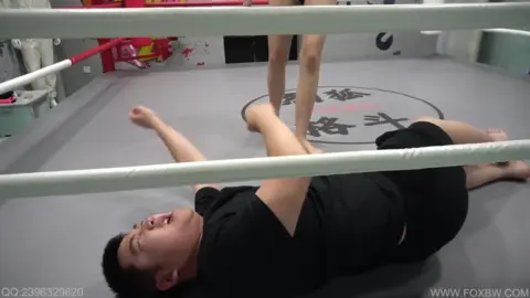 Asian Couple Boxing Ring Encounter