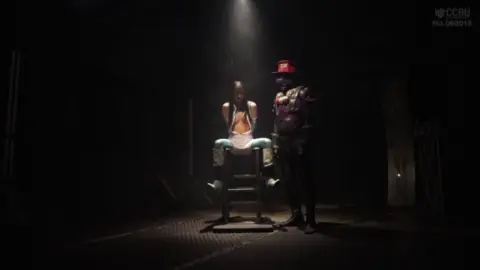 Asian BDSM Scene with Restraints and Costume