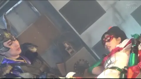 Asian Women in Costumes Embracing Backstage