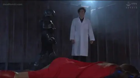 Asian Performer in Costume Dancing on Stage