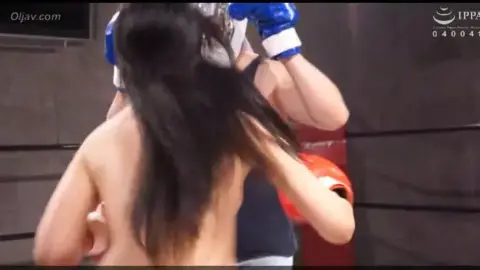 Asian Couple Boxing in Ring
