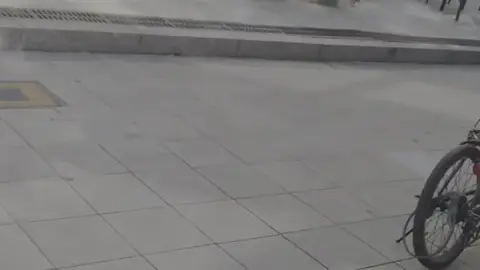 Blonde Asian Businesswoman in Black Suit