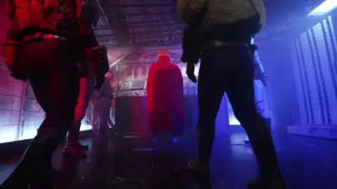 Asian Performers in Costume Fight Scene