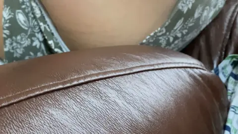 Asian Teen Seduces on Leather Couch