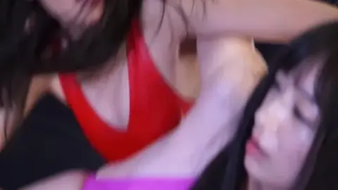 Asian Women Wrestling in Ring