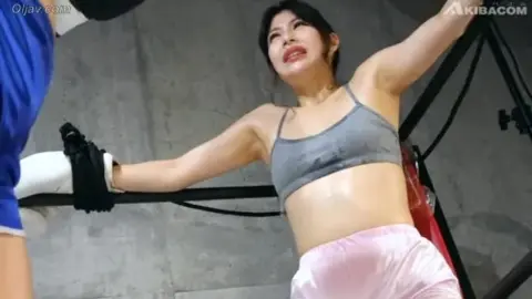 Asian Women Boxing Match in Gym