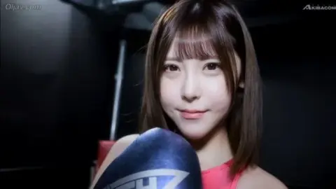 Asian Woman in Boxing Ring with Male Partner