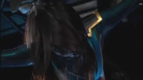 Asian Women in Blue and Gold Costume