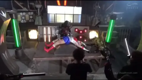 Asian Cosplay Babe Fights in Industrial Setting