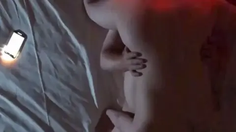 Asian Couple Intimate Moments on Bed