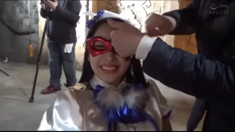 Asian Beauty in White Dress and Red Mask