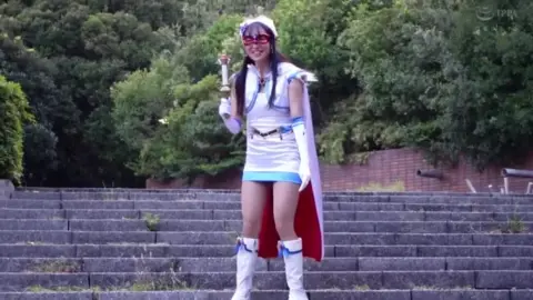 Cosplay Girl in White and Blue Costume