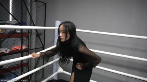 Asian Women Wrestling in Boxing Ring