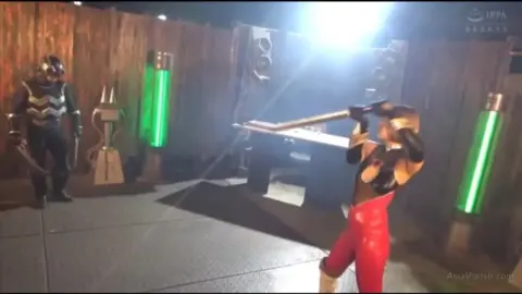 Blonde Asian in Red Costume Performs Erotic Poses