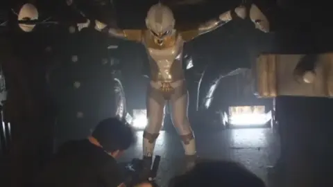 Men in Masks and Costumes Studio Photos