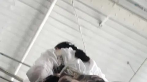 Asian Models in Stockings and Gold Dresses