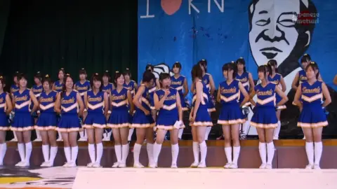 Asian Performers Dancing on Stage