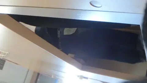 Blonde in Black Top Under Desk POV