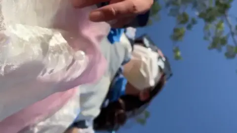 Asian girl in white dress outdoors