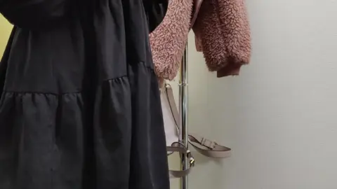 Asian Teen Tries On Outfits in Fitting Room