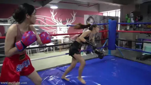 Asian Women Boxing in Gym