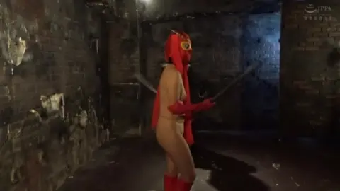 Asian Performers in Red Masks and Leather Gear