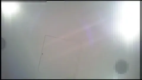 Intimate Bedroom Encounter with Dark-Haired Woman