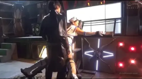 Masked Couple in Industrial Setting