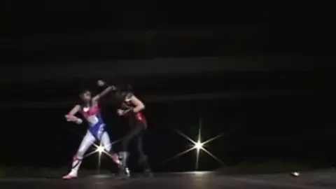 Asian Women in Futuristic Costumes Engage in Intimate Encounters