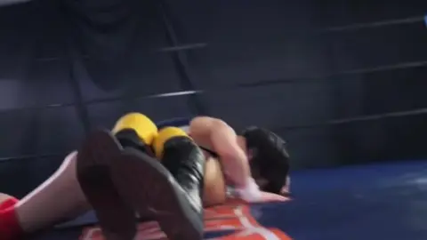 Dark Haired Women Wrestling Match